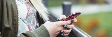 a girl holding a phone